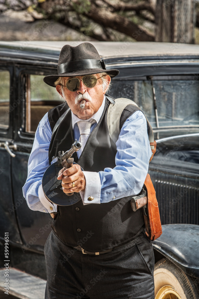 Fototapeta premium Male Gangster Aiming Machine Gun