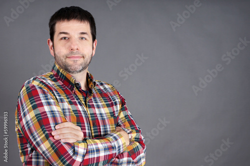 Confident man on grey