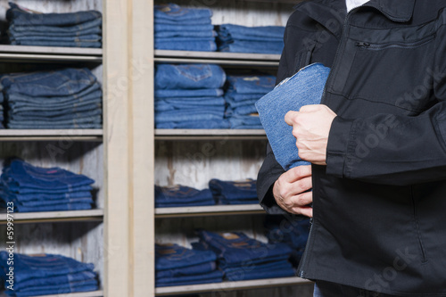 shoplifter stealing denim