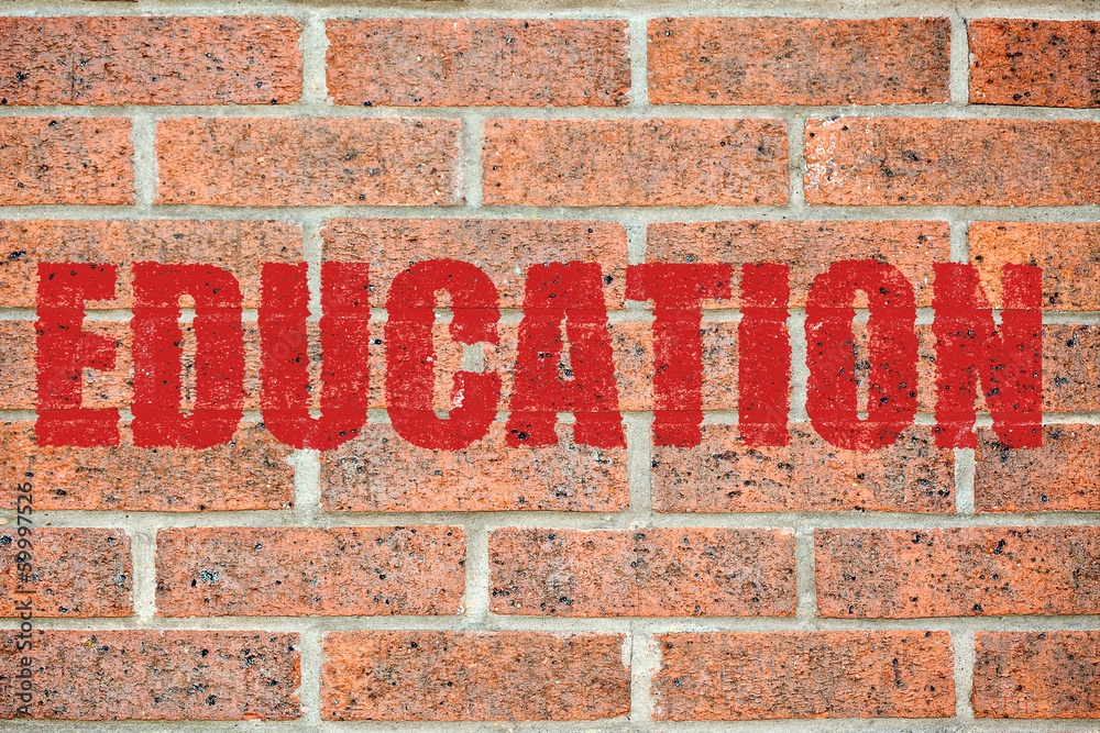Old brick wall texture with EDUCATION inscription Old brick wall texture with EDUCATION inscription