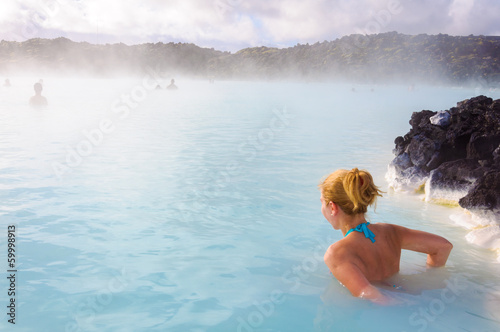 Beautiful young woman in Blue Lagoon geothermal spring   Iceland