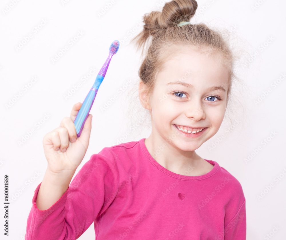 Happy smiling child girl in pyjamas with toothbrush - bedtime Happy smiling child girl in pyjamas with toothbrush - bedtime