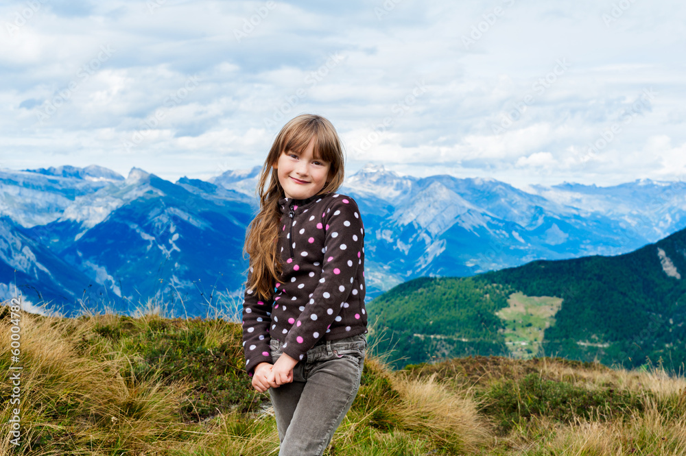 portrait of little girl with mountains on background portrait of little girl with mountains on background