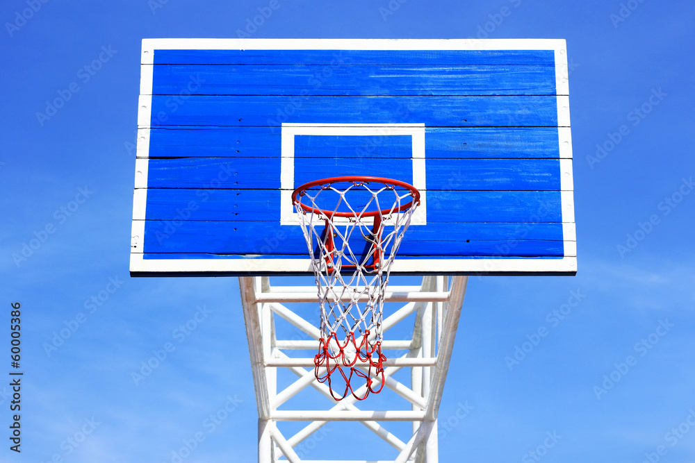 Basketball board with  hoop on blue sky background