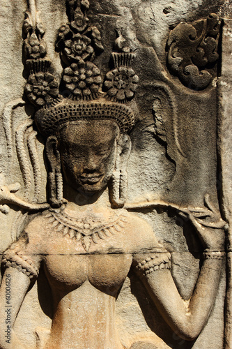 Stone ancient Apsara engraving on Angkor wat photo