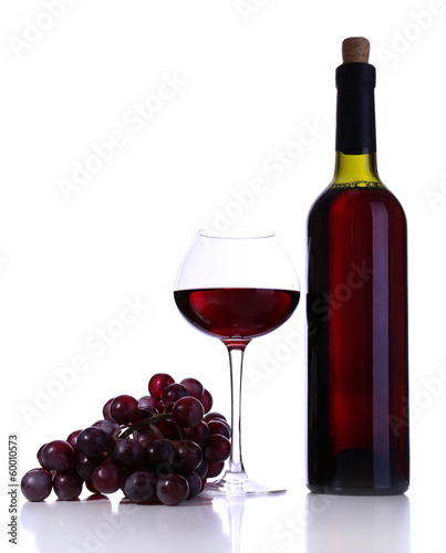 Wineglass with red wine, grape and bottle isolated on white