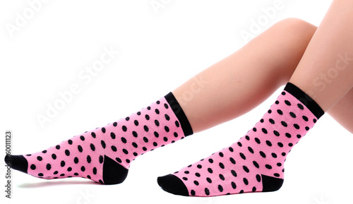 Female legs in colorful socks, isolated on white