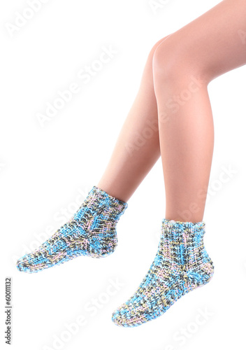 Female legs in colorful socks, isolated on white