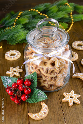 Fototapeta Naklejka Na Ścianę i Meble -  Delicious Christmas cookies in jar on table close-up