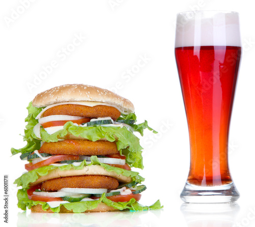 Huge burger and glass cold beer, isolated on white