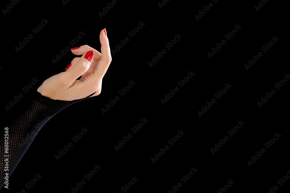 Obraz premium Beautiful woman hand with ruched glove isolated black backgraund