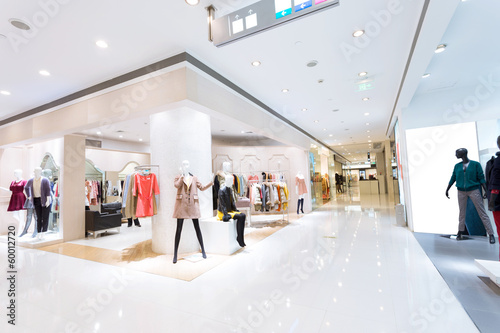 Boutique display window with mannequins in fashionable dresses