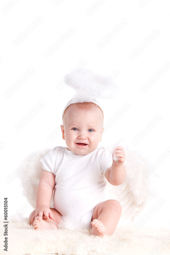 Portrait of a little boy with angel wings, isolated on white