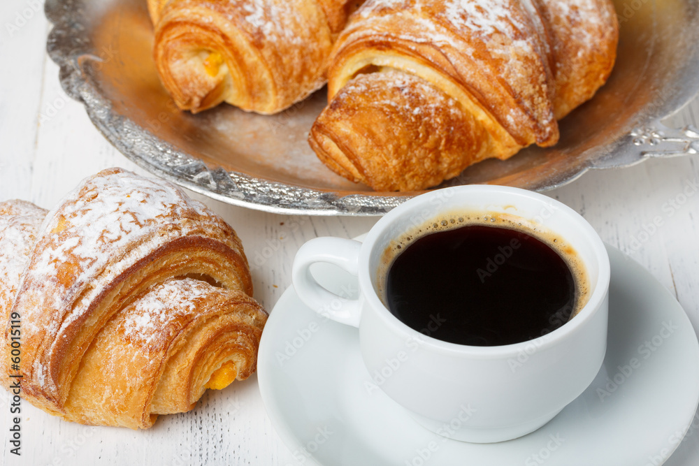 Coffee with fresh croissants