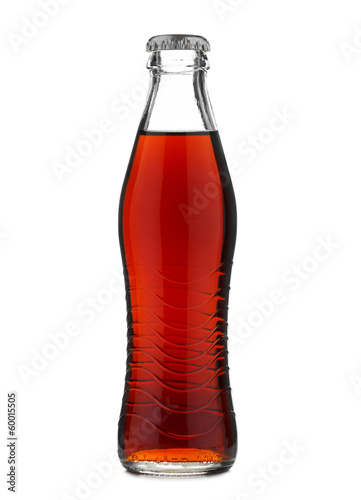 Closed glass bottle with soft drink cola or soda