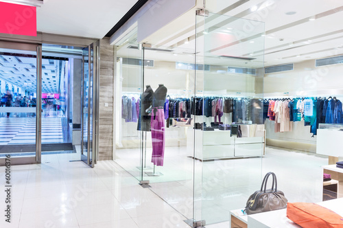 Boutique display window with mannequins in fashionable dresses