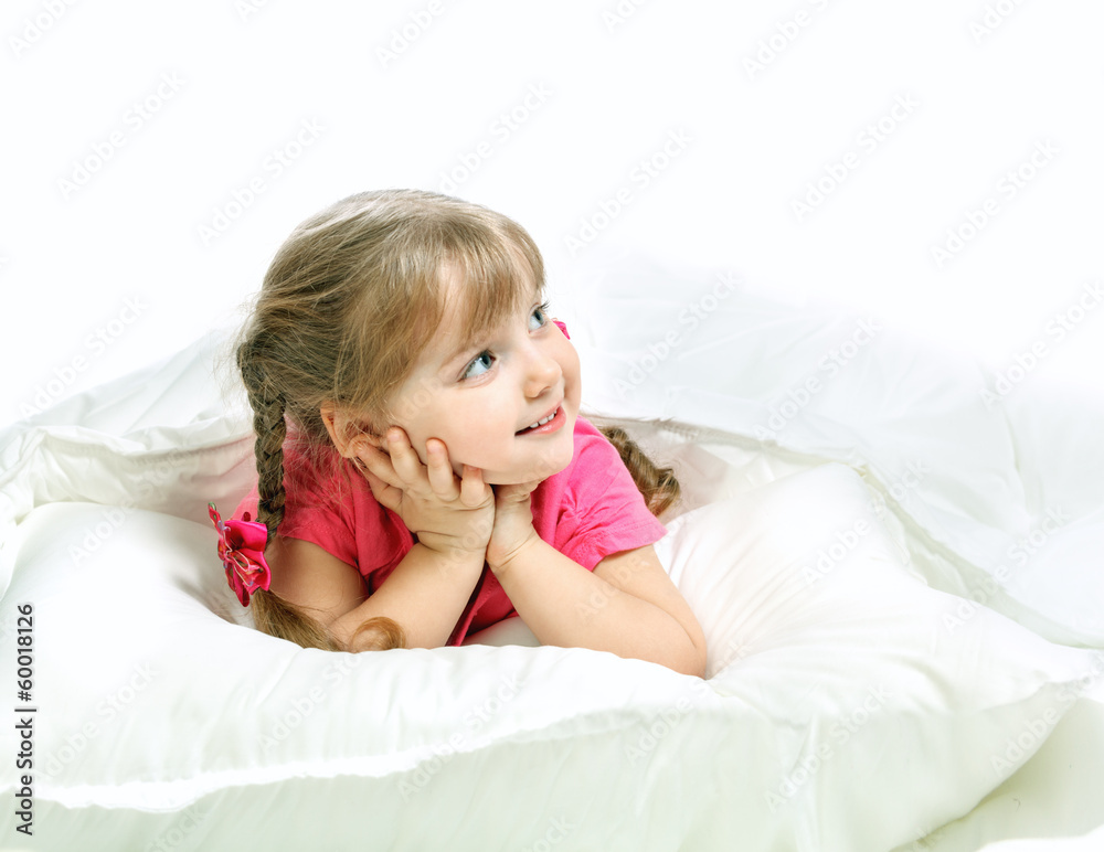 Portrait of a little girl lying in bed Portrait of a little girl lying in bed