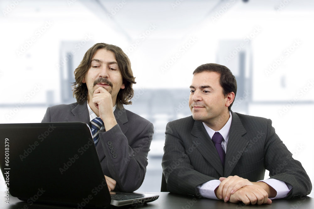 Two business men with laptop computer