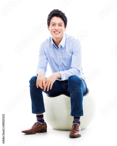Young Asian person sitting on the chair.