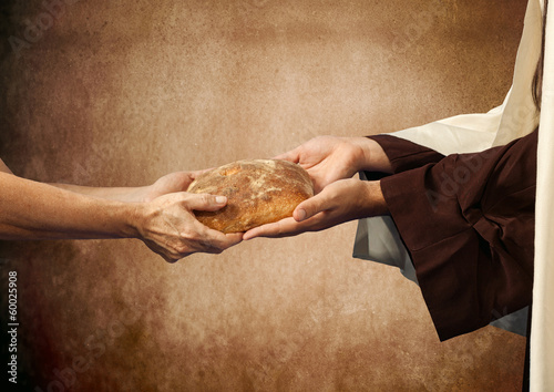 Jesus gives the bread to a beggar. photo