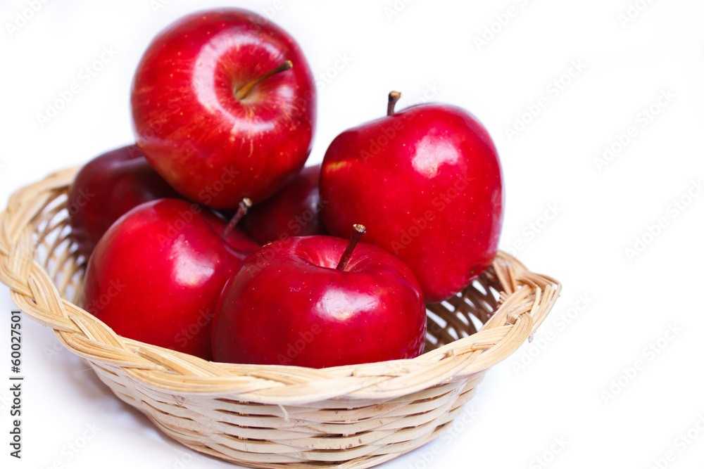 Apples in a yellow basket.