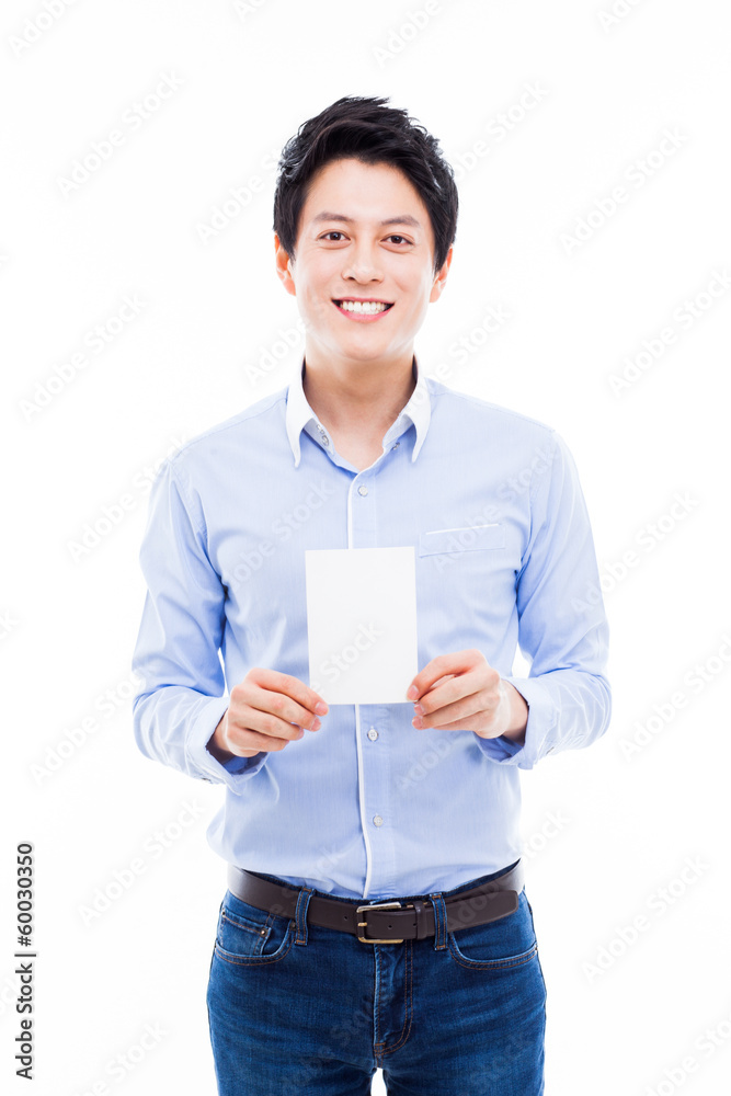Young asian man showing empty card. Young asian man showing empty card.
