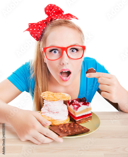 Funny woman eating dessert, sweet temptation photo
