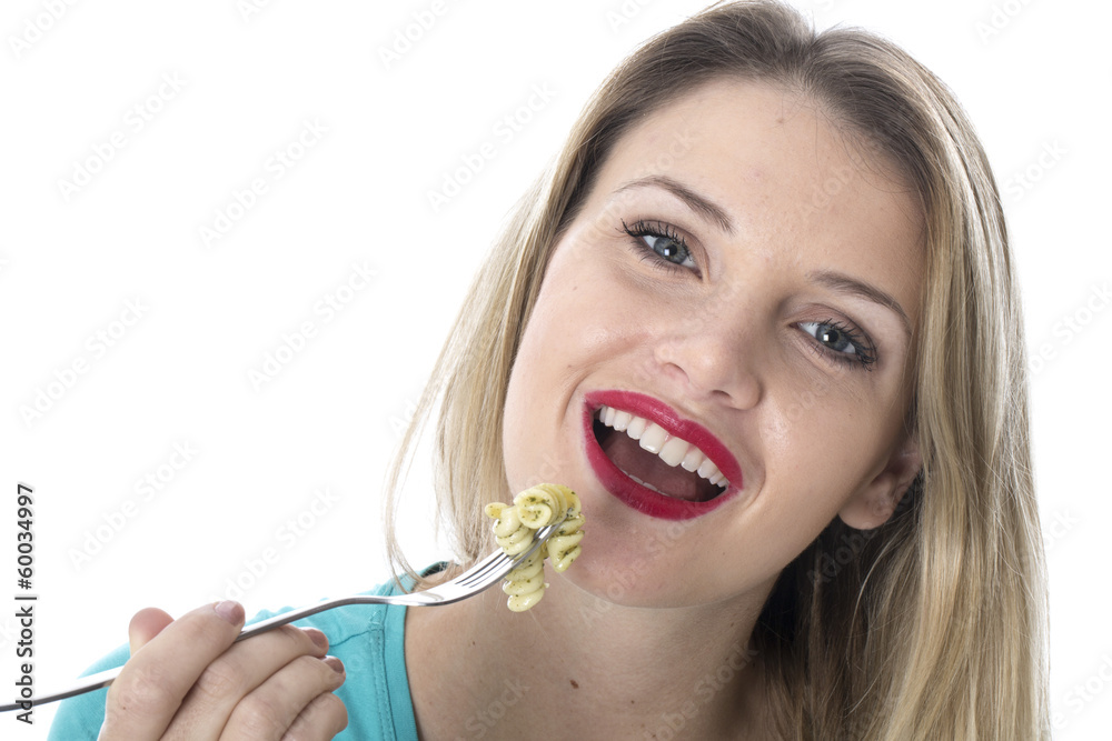 Young Woman Eating Spinach and Pine Nut Pasta Young Woman Eating Spinach and Pine Nut Pasta