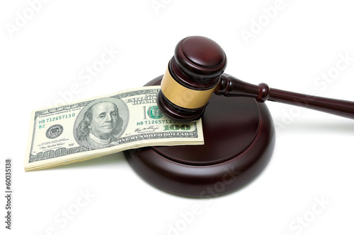 money and gavel on white background close up
