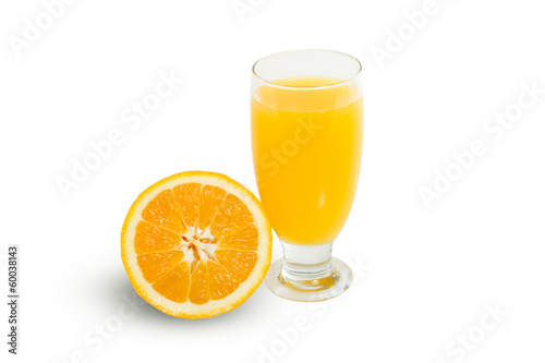 Glass of fresh orange juice with sliced oranges on white backgro