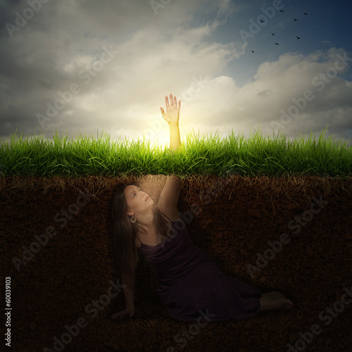 Billede på lærred A woman buried under ground reaching out for help.