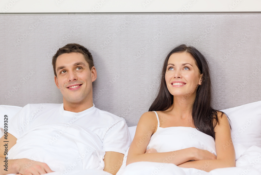 happy couple dreaming in bed happy couple dreaming in bed