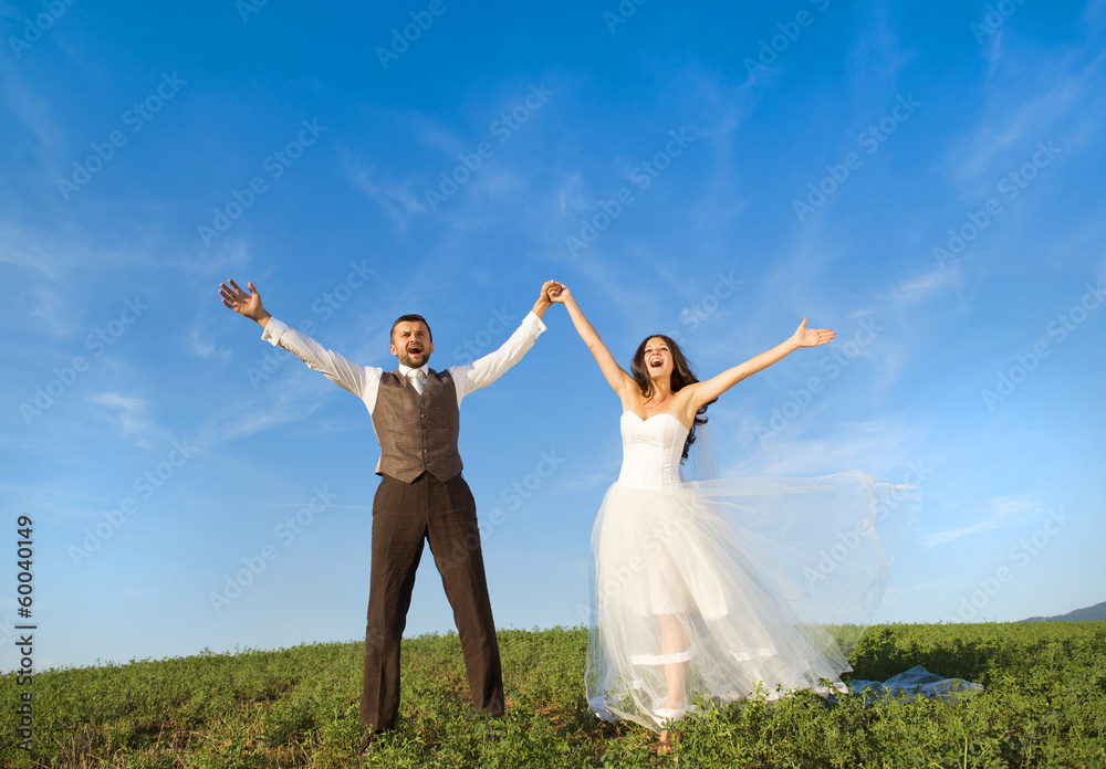 Newly married couple portrait with blue sky Newly married couple portrait with blue sky