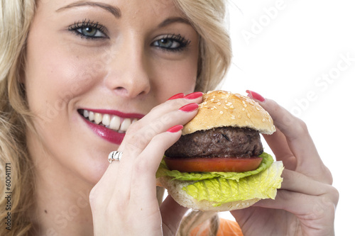 Young Woman Eating a Beef Burger