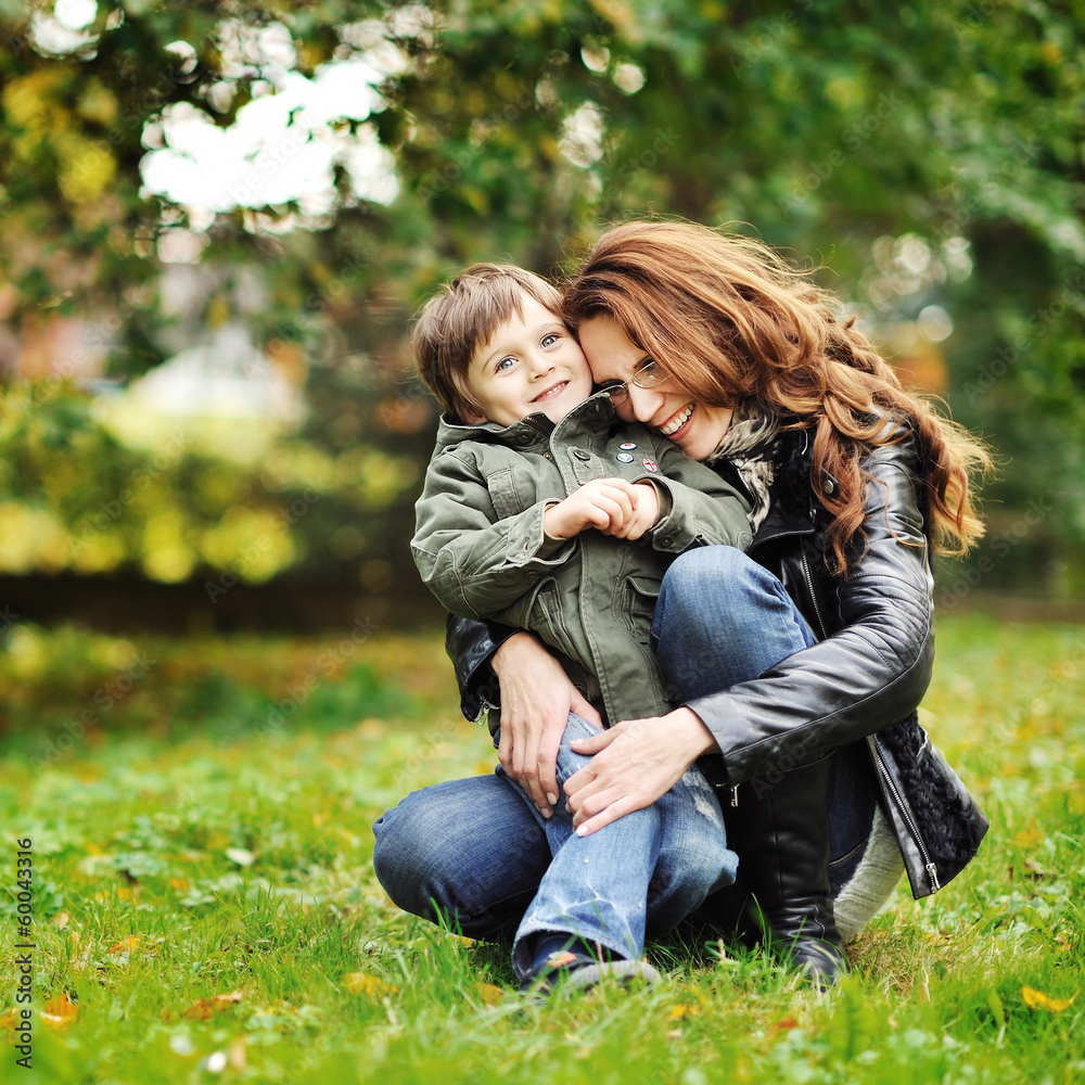 Happy mother hugging her little son. Family idyll concept Happy mother hugging her little son. Family idyll concept