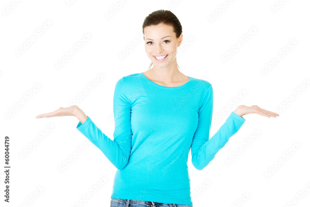 Young beautiful casual woman has empty space on her palms. Young beautiful casual woman has empty space on her palms.