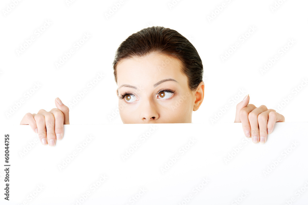 Young beautiful casual woman holding copy space. Young beautiful casual woman holding copy space.