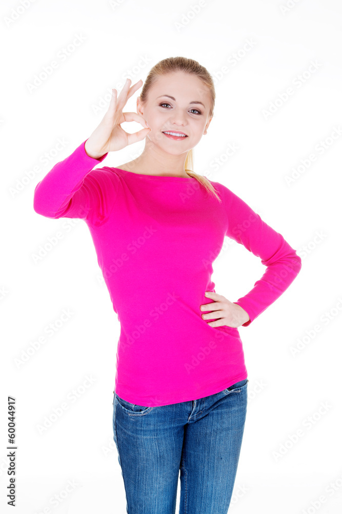 Fototapeta premium young casual woman student showin OK gesture.
