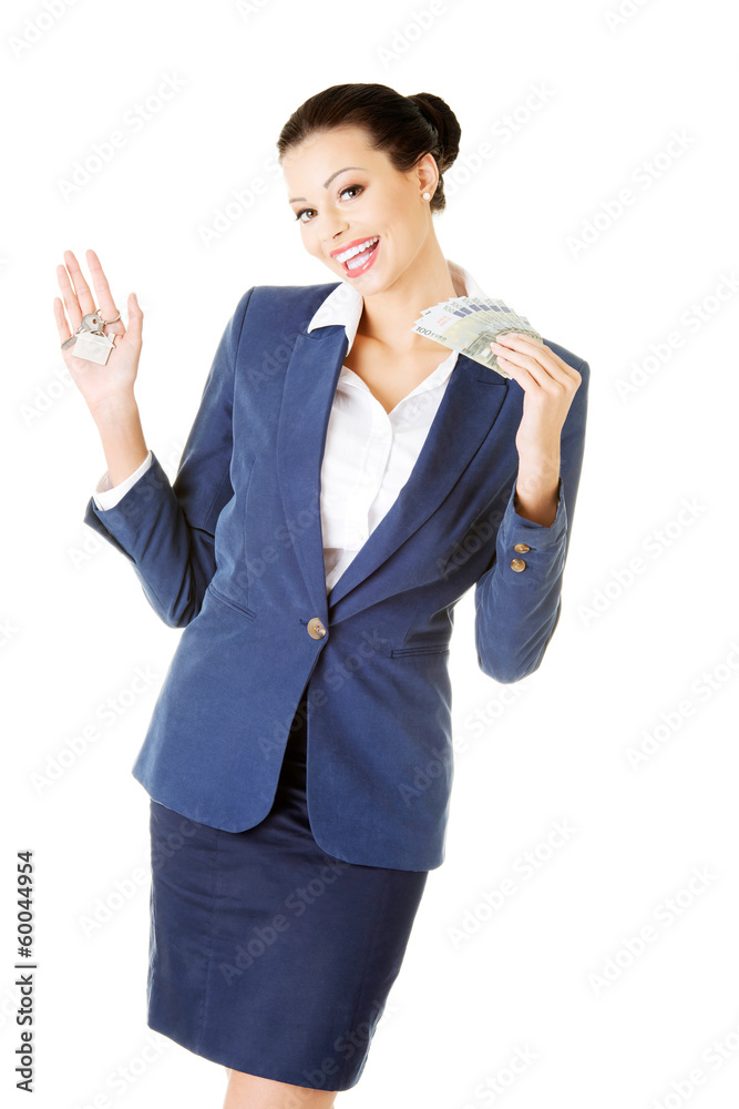 Beautiful young business woman with money and keys. Beautiful young business woman with money and keys.