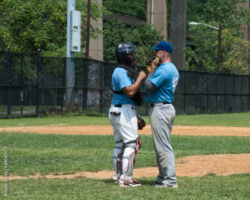 Pitcher and Catcher Talking © 56426358