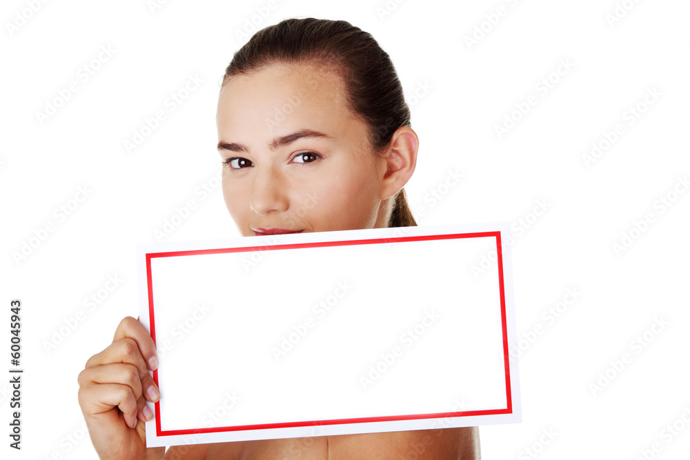 Young beautiful casual woman holding copy space. Young beautiful casual woman holding copy space.