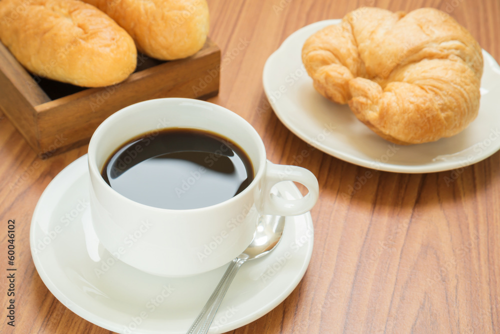 Coffee cup and croissant Coffee cup and croissant