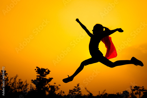 teen girl jumping on the nature