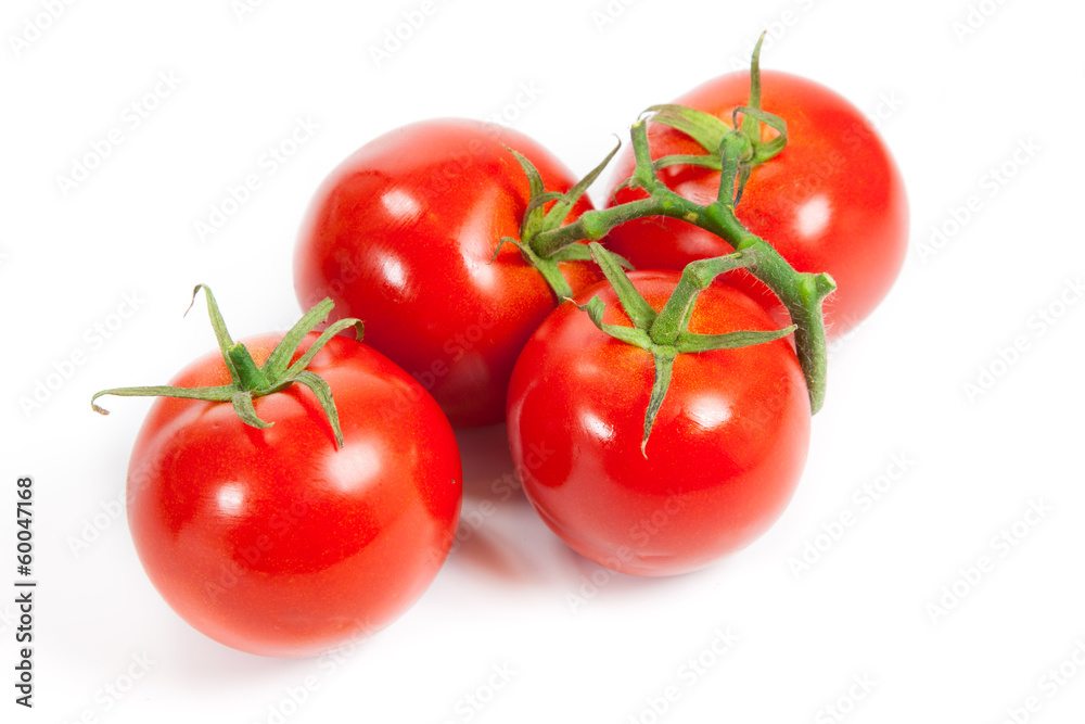 three fresh tomatoes with green leaves isolated on white backgro three fresh tomatoes with green leaves isolated on white backgro