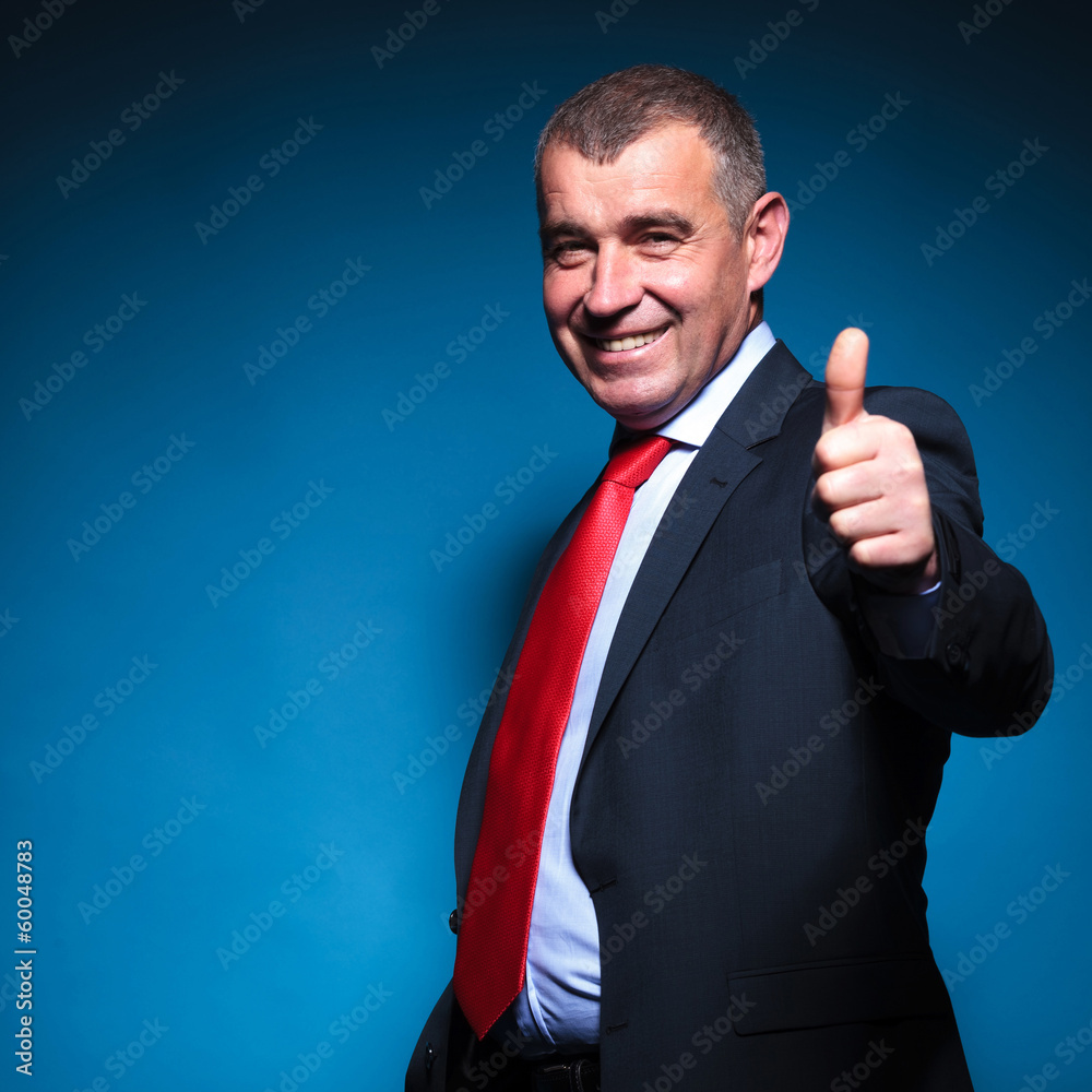 mature business man making the ok sign mature business man making the ok sign