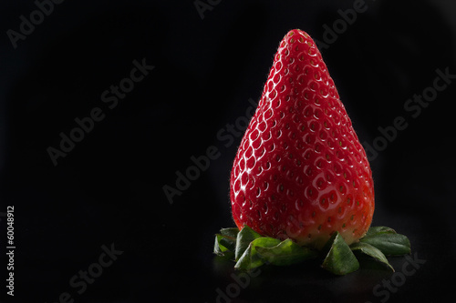 Fresh strawberry on black background