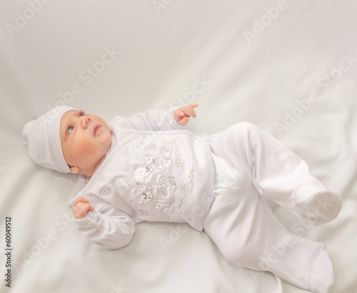 baby in white a cap