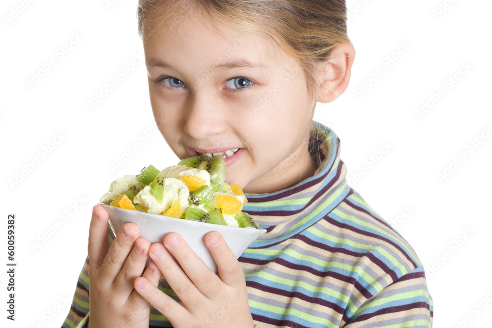 child eats dessert with ice cream and fruits child eats dessert with ice cream and fruits