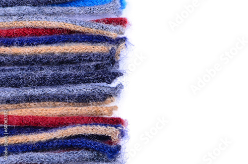 Coloured woolen threads on a white background