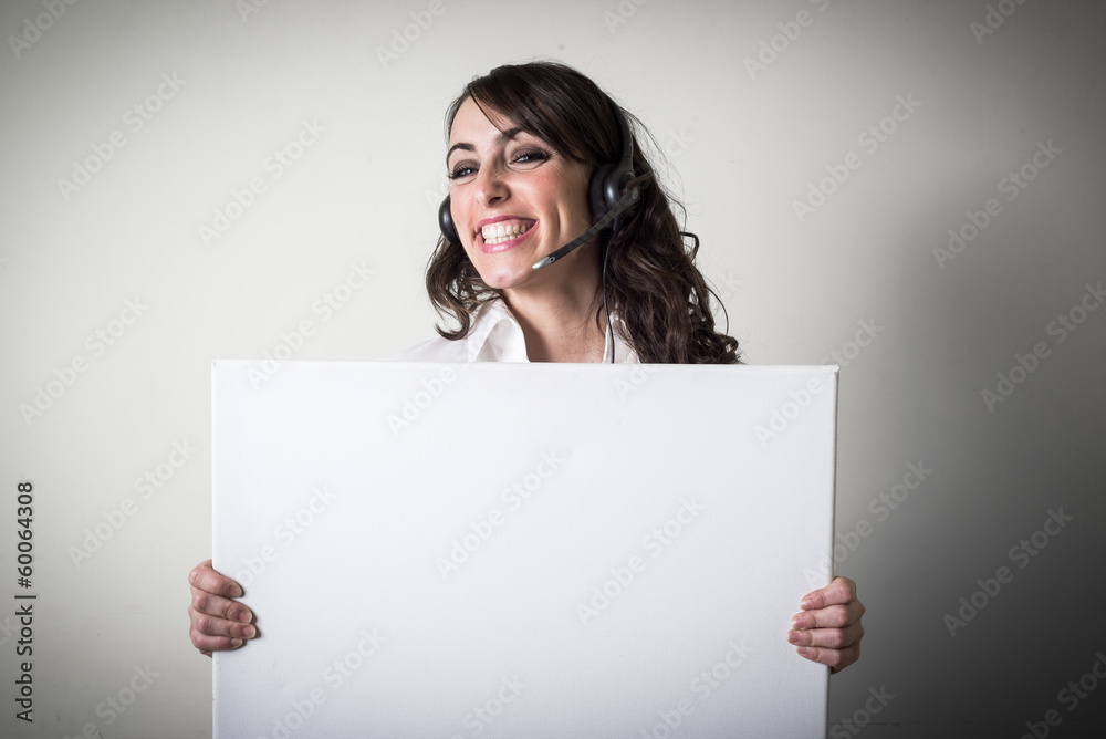 beautiful young businesswoman holding white board